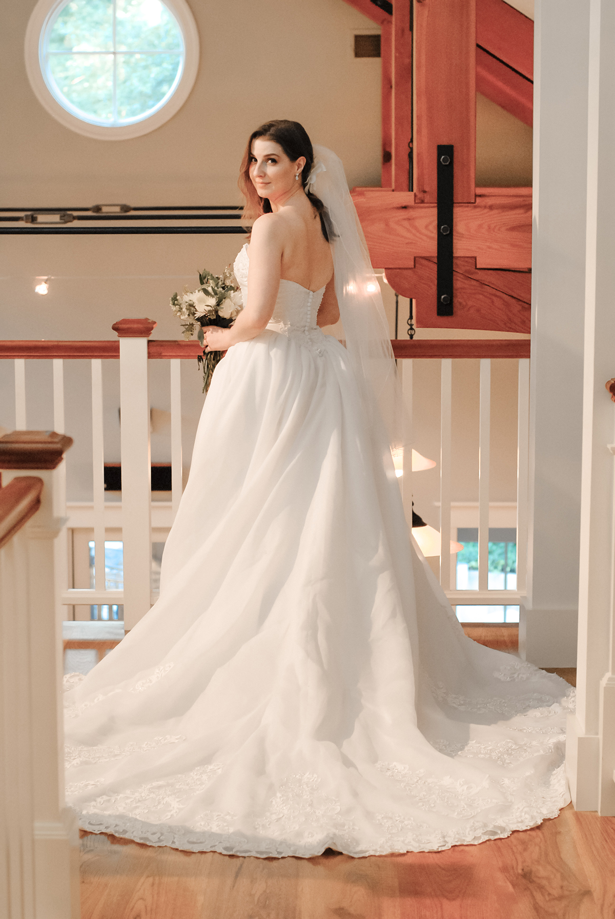 Devon in ballgown wedding dress with a long train