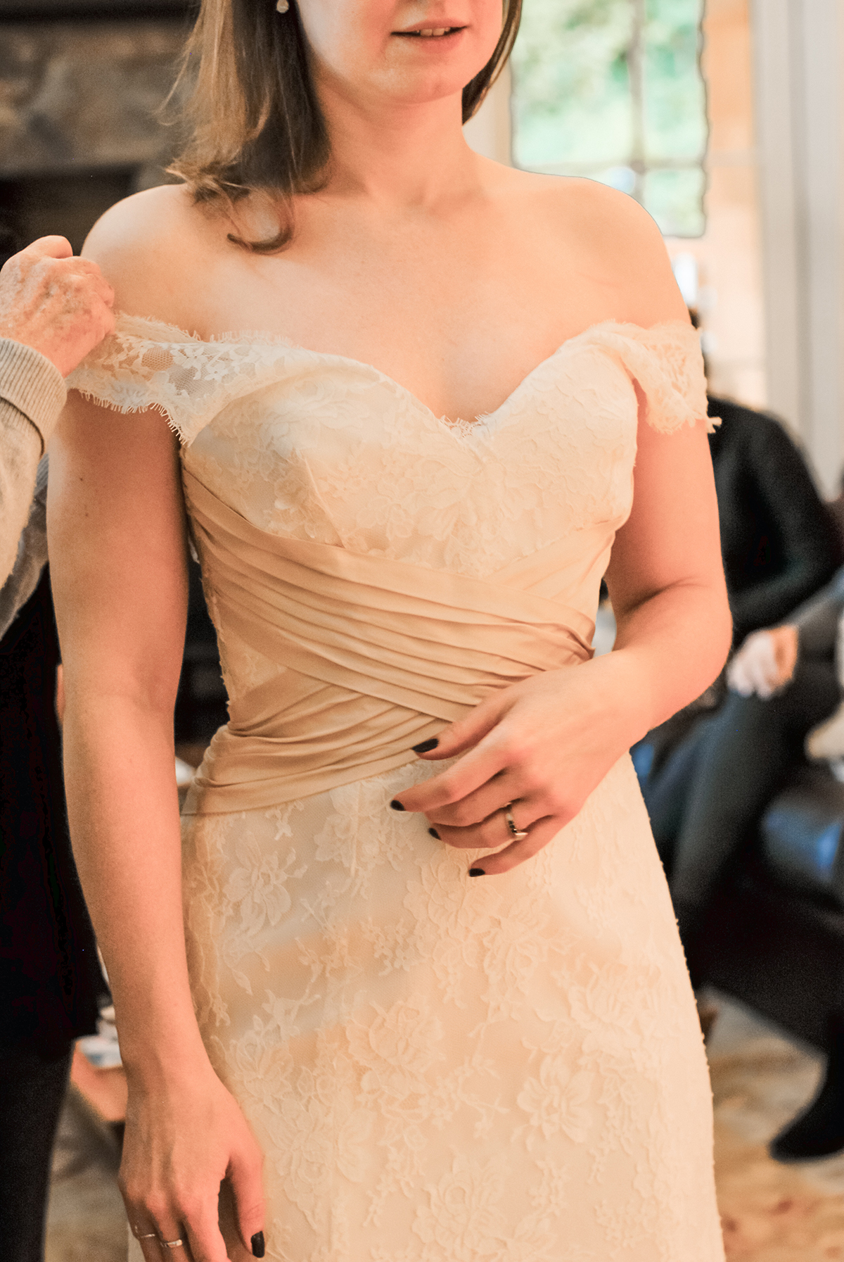 Close up on a ivory lace wedding dress